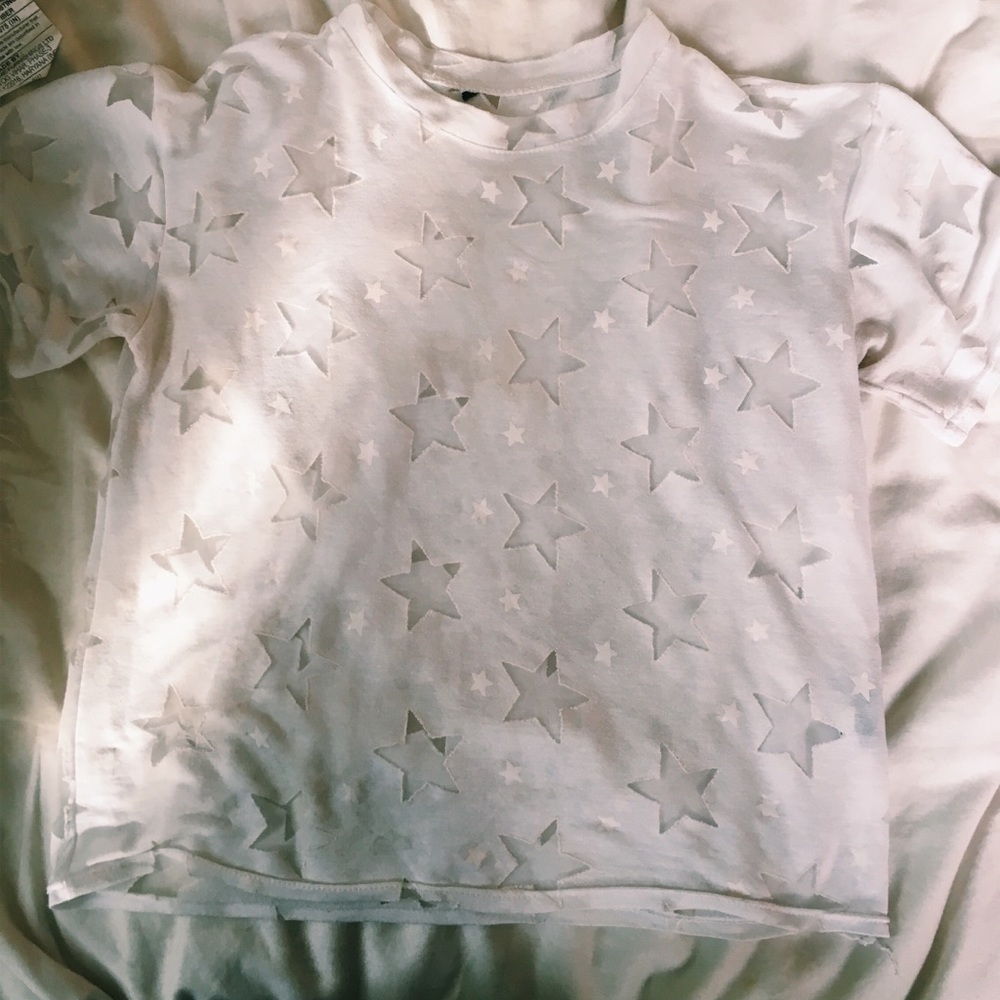 White tee with mesh star detail.